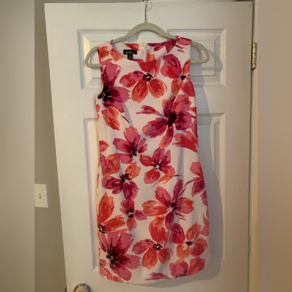 Spring dress from Macy’s. Hits just above knee. Appropriate for work. Size 4.